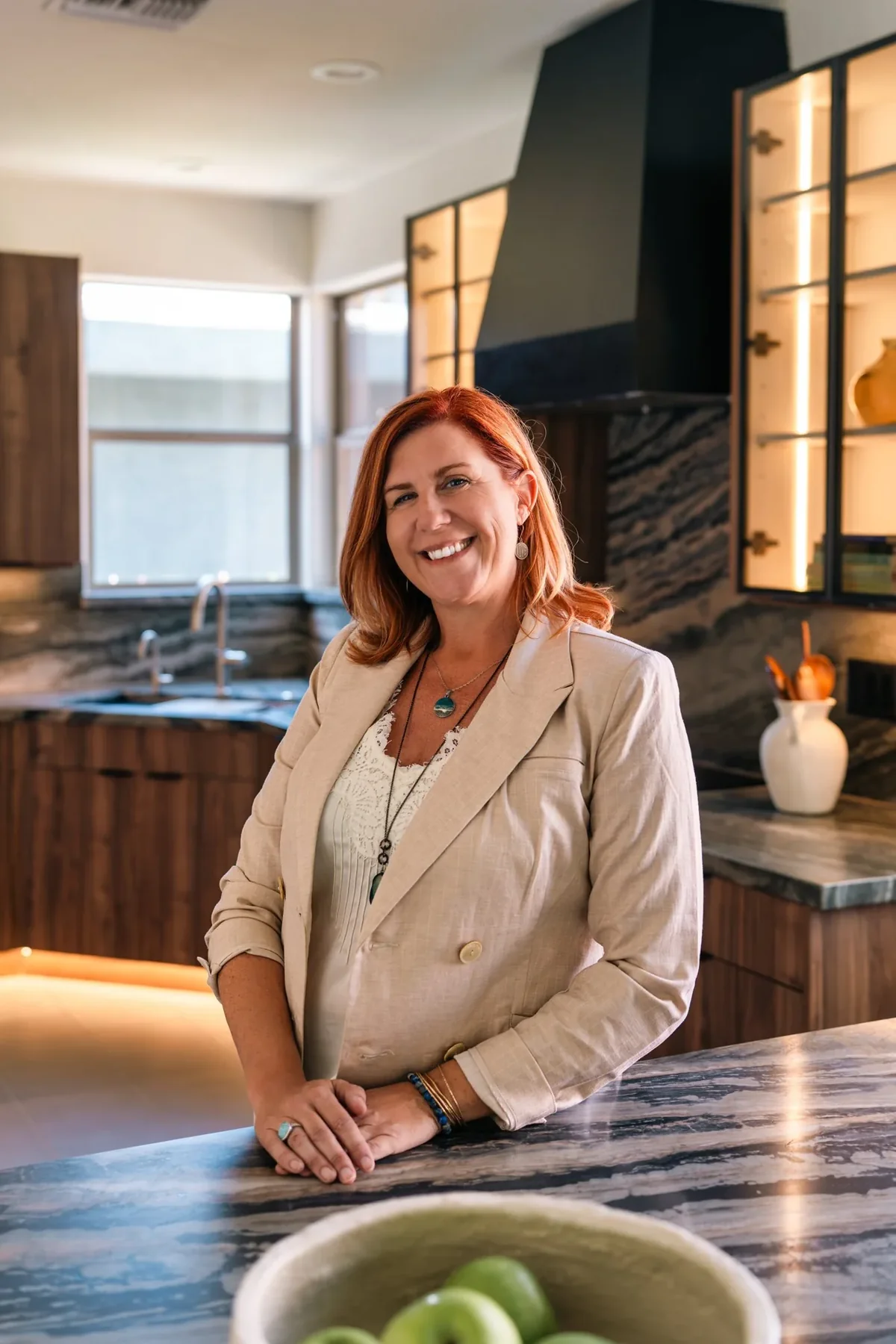 Audrey, founder of Artisan Design Remodel, in a completed Phoenix kitchen remodel