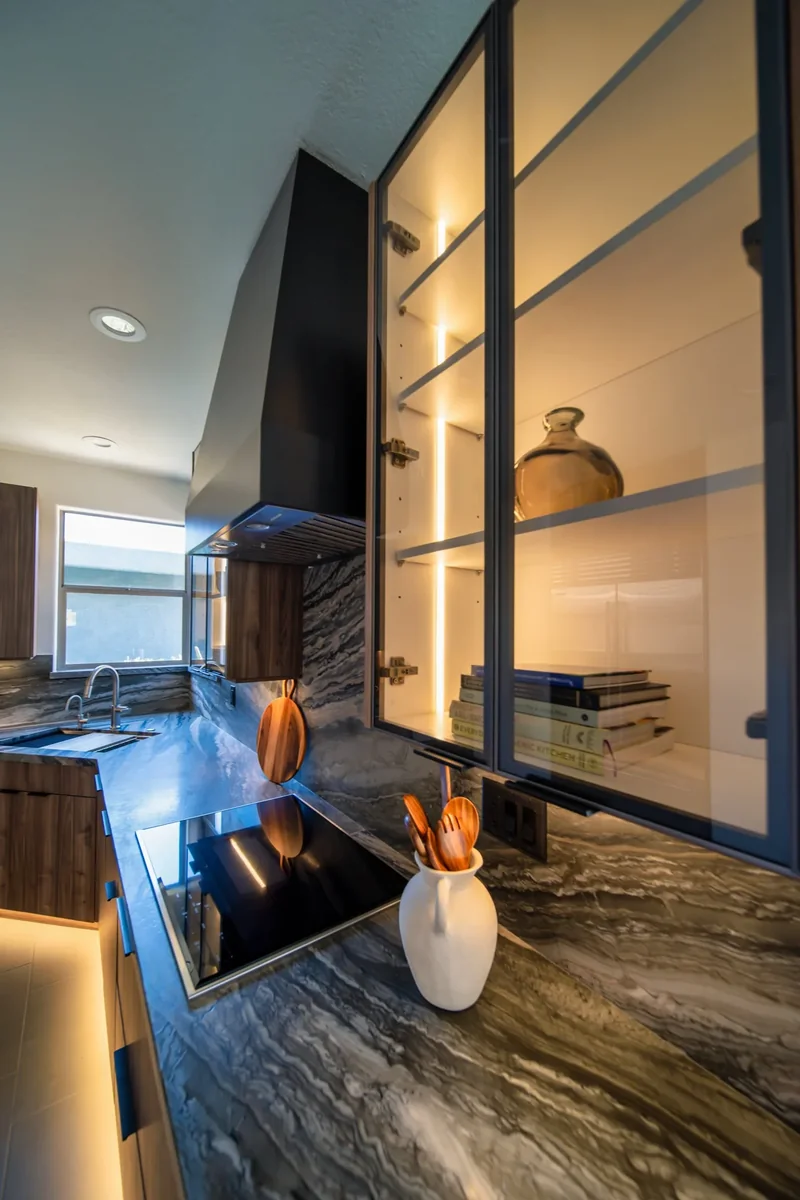 Lit glass-front cabinets in a Fountain Hills, AZ kitchen remodel