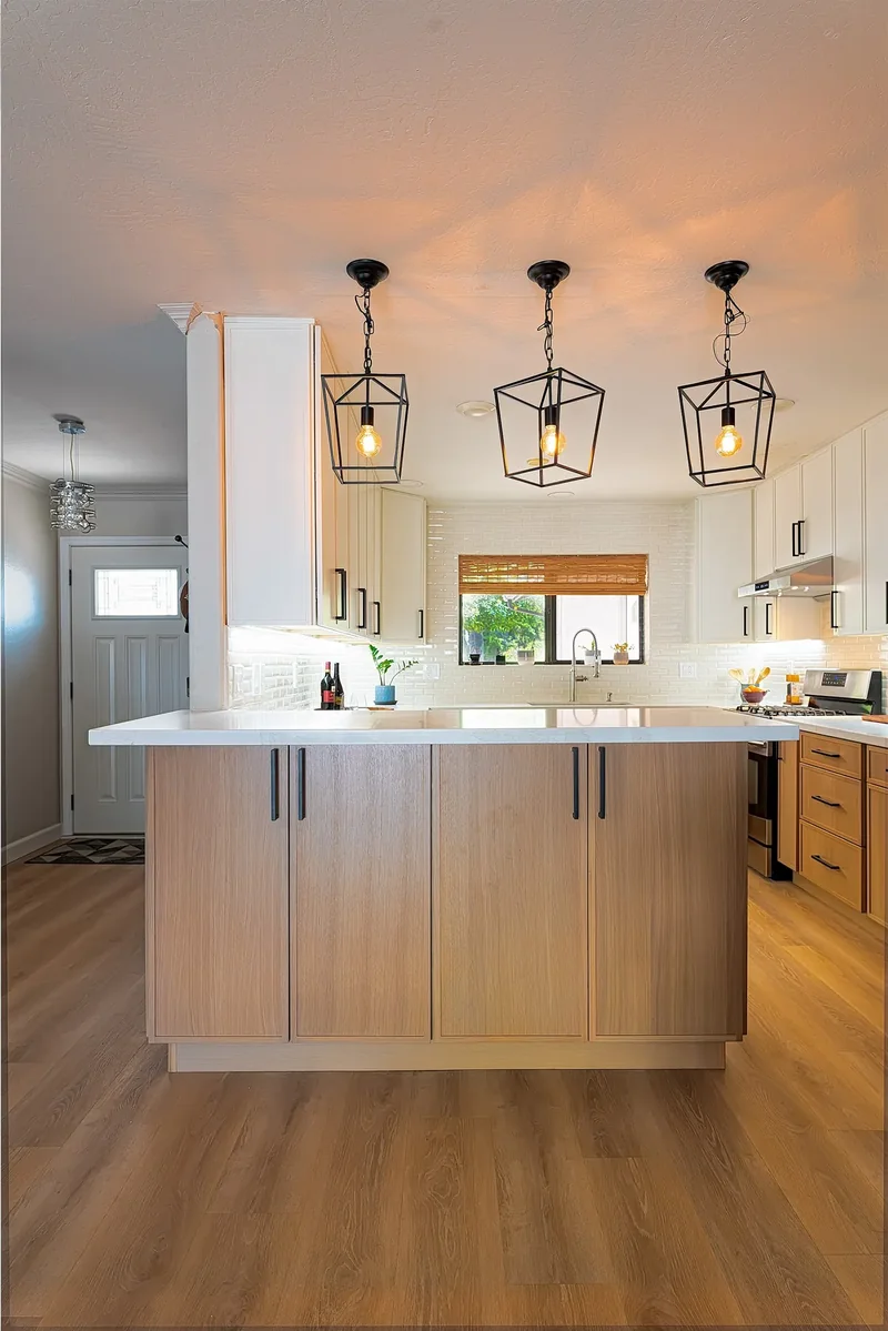 Light, airy kitchen remodel in Phoenix, AZ with new island and LVP flooring