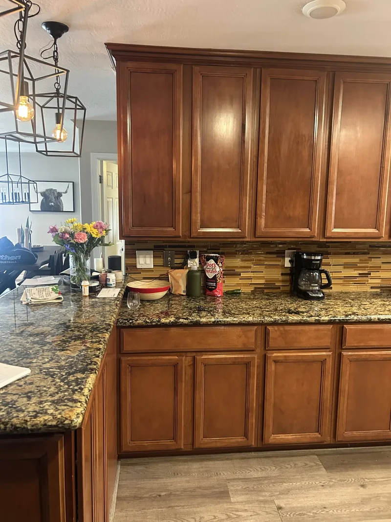 Original dark, dated kitchen with cherry cabinetry before Phoenix remodel