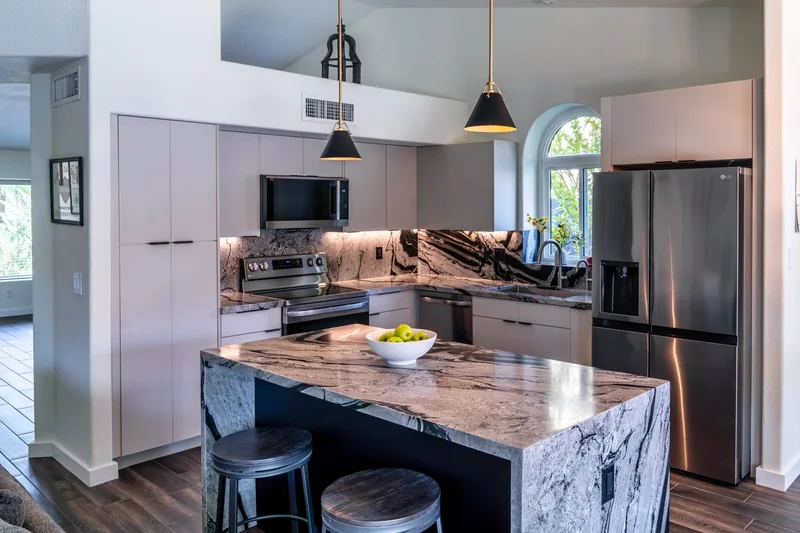 Open-concept Phoenix kitchen design with island seating and dining nook