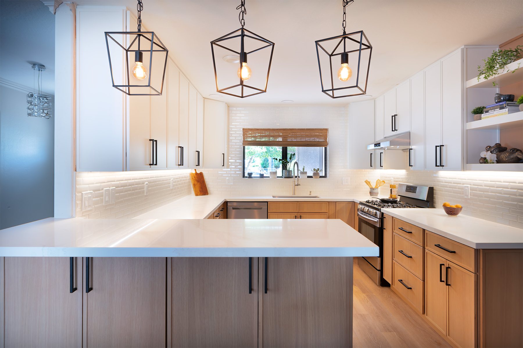 Quartz countertops in a full kitchen remodel with pendant lighting in Phoenix